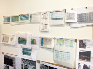 An image of the work from the on Blue Room House One charette as it hangs on the walls of Studio K2 Architecture.