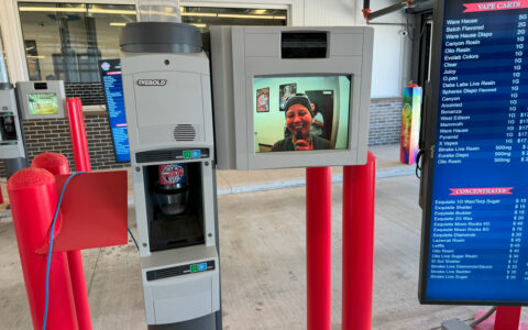 dispensary drive-thru showing video connections and vacuum tubes for transactions